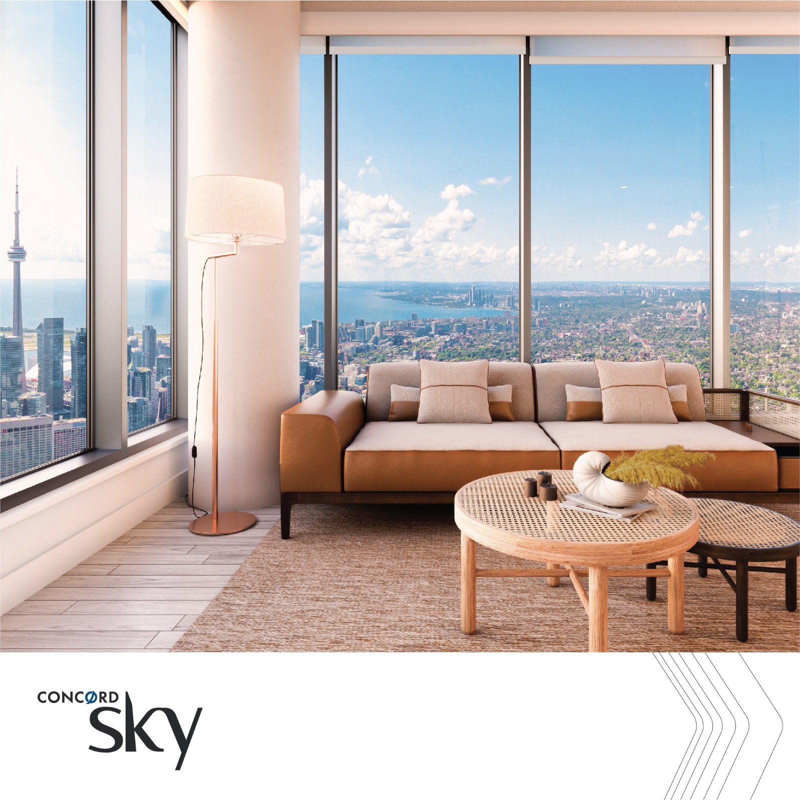 Living room with floor-to-ceiling views of the Toronto skyline and lake