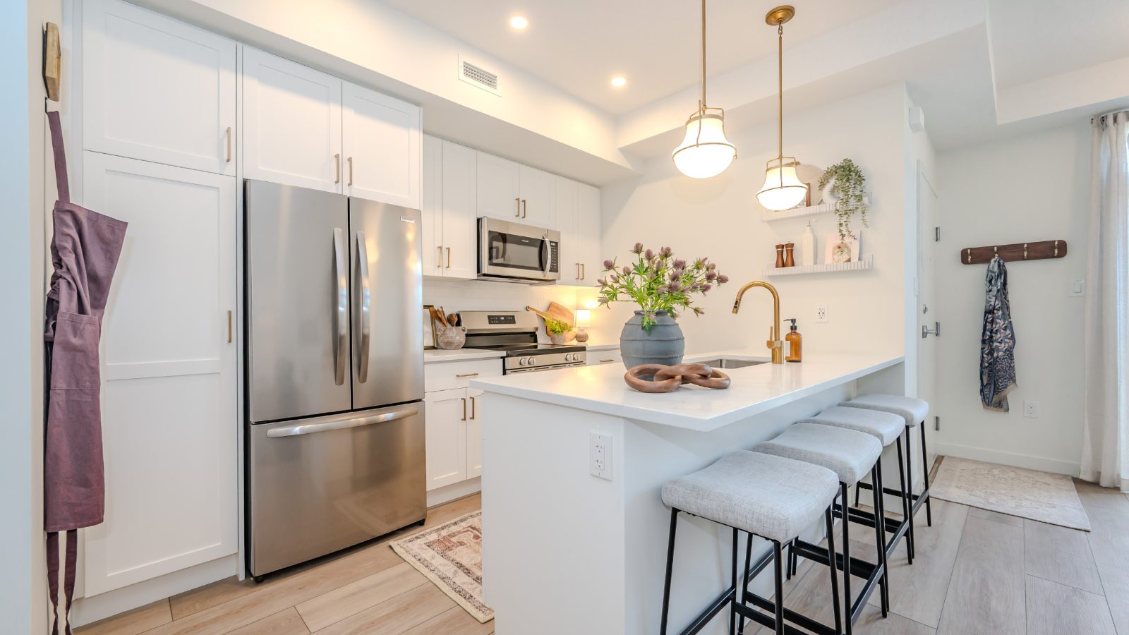 Modern kitchen with island seating and stainless appliances