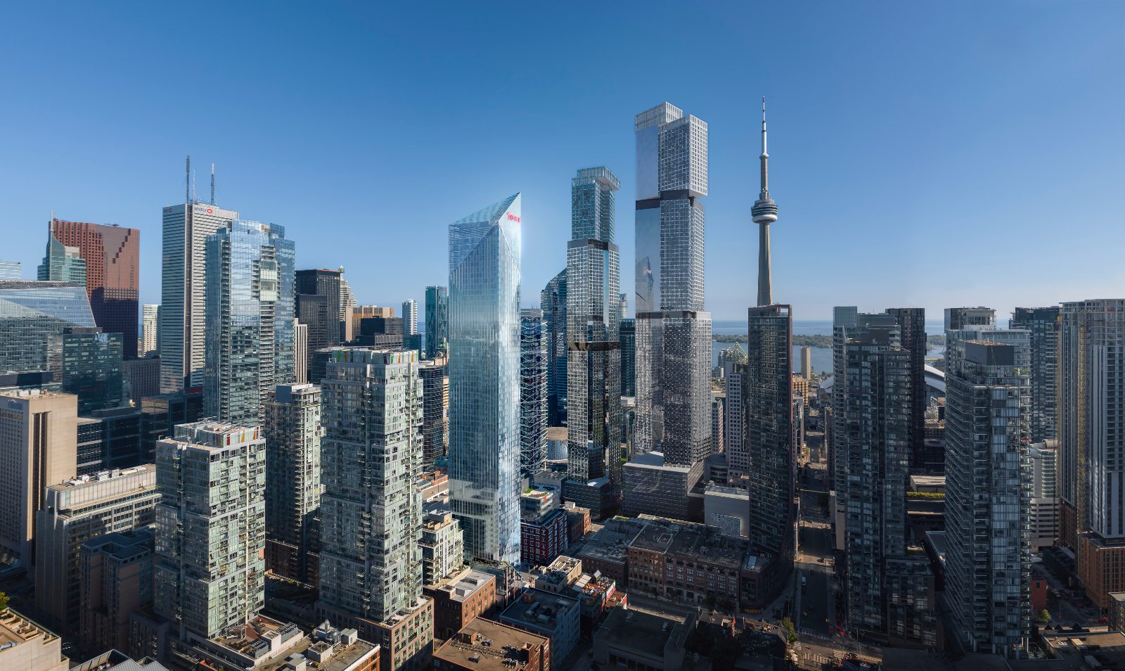Aerial rendering of the Freed Hotel & Residences glass tower rising over downtown Toronto beside the CN Tower and Lake Ontario
