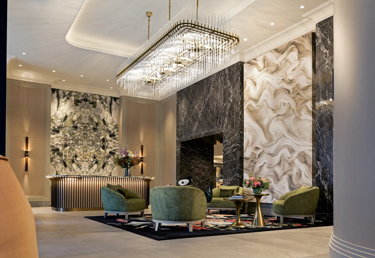 Edenbridge lobby with crystal chandelier, dramatic marble walls, sculpted feature wall and green velvet lounge seating