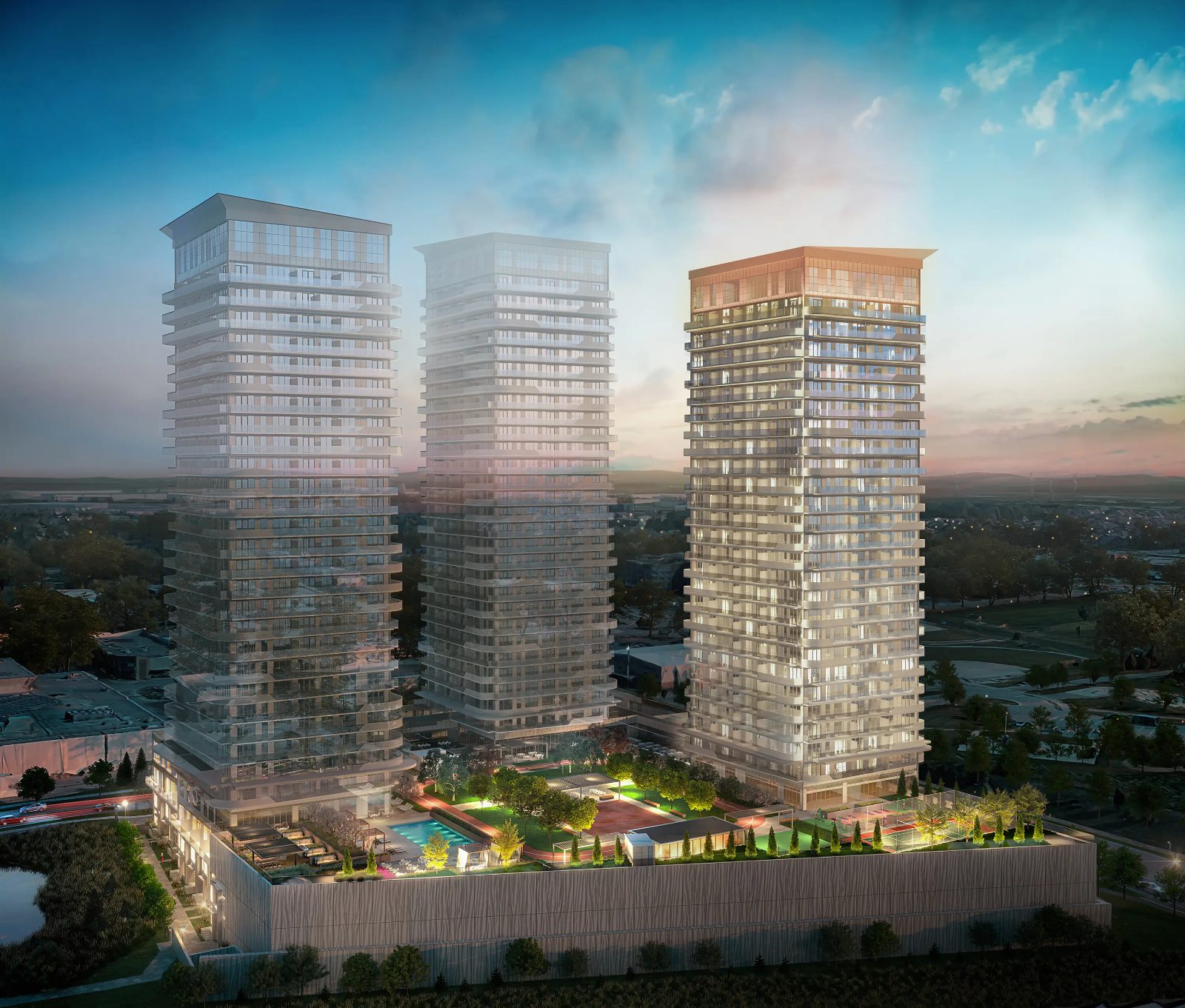Sienna at Thompson Towers — dusk rendering of three residential towers over landscaped grounds in Milton
