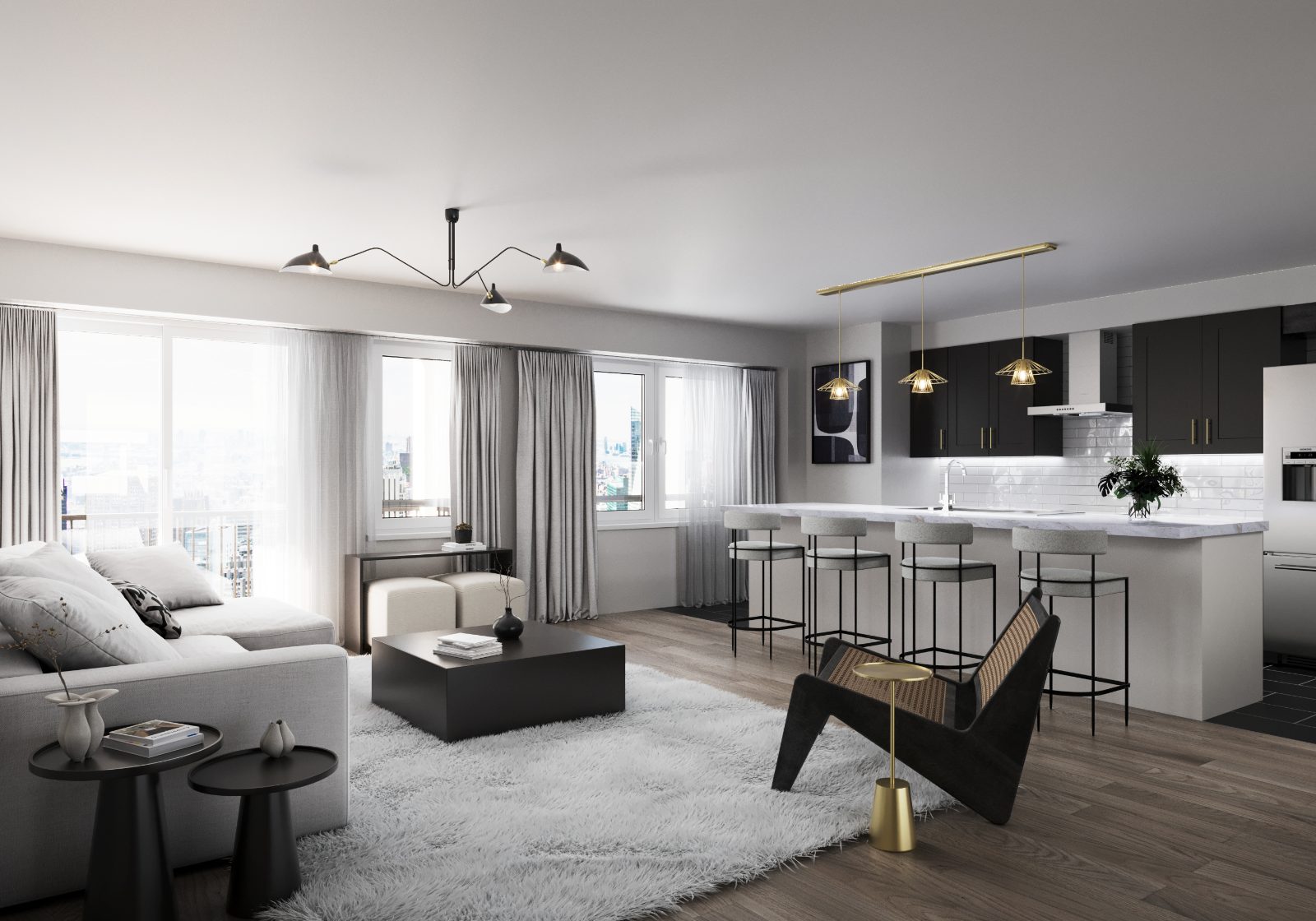 Open-concept great room and kitchen with island seating, black cabinetry, and brass pendant lights