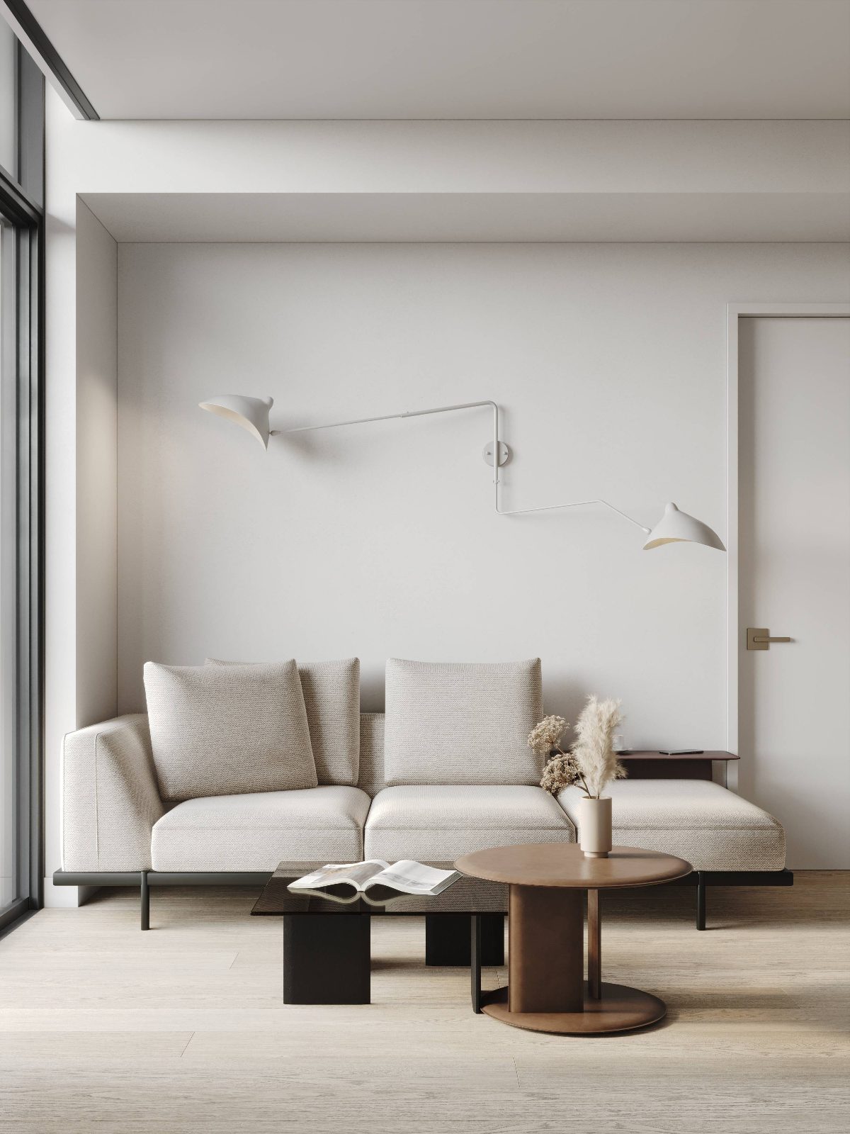 Minimalist suite living area with light wood floors and sculptural wall sconce
