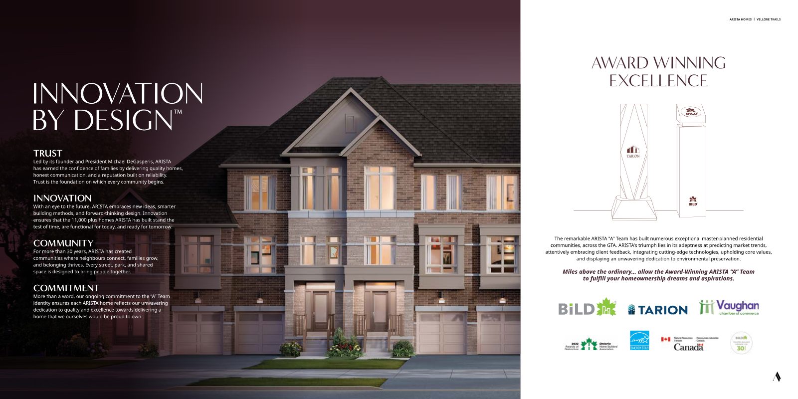 Evening rendering of brick and stone Arista townhomes with gabled rooflines and warm lit windows