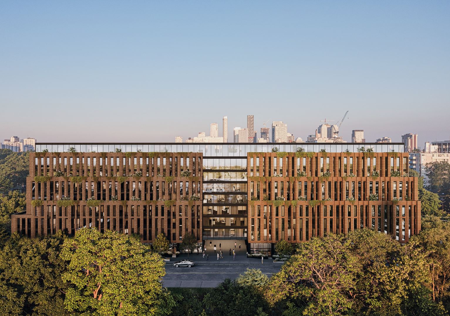 Leaside Common rendering: a brick-clad nine-storey mid-rise with planted terraces and a glass penthouse level, set above Leaside's tree canopy with the midtown Toronto skyline behind